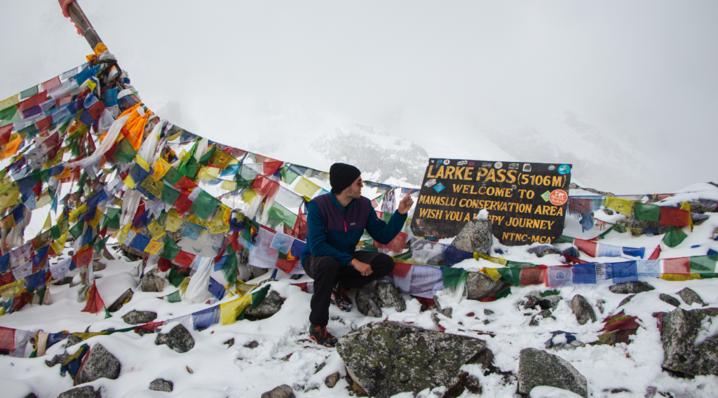 Trekkers crossing Larkya La Pass 5160m Manaslu Circuit