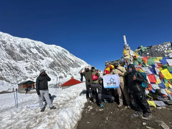 guest taking photo at Tilicho Lake