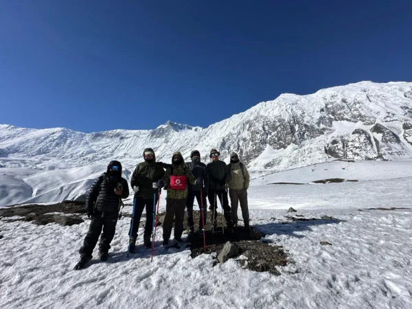 guest taking photos infront of Tilicho peak